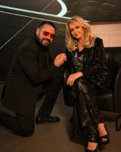 “Will you marry me again?” he asks, dropping to one knee—her smile falters for a split second, eyes searching his… and then, just before she პასუხs, everything changes just as…